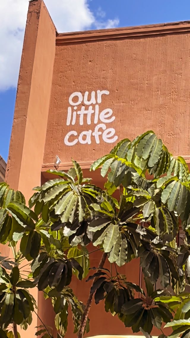 Our Little Cafe exterior facade with brand sign